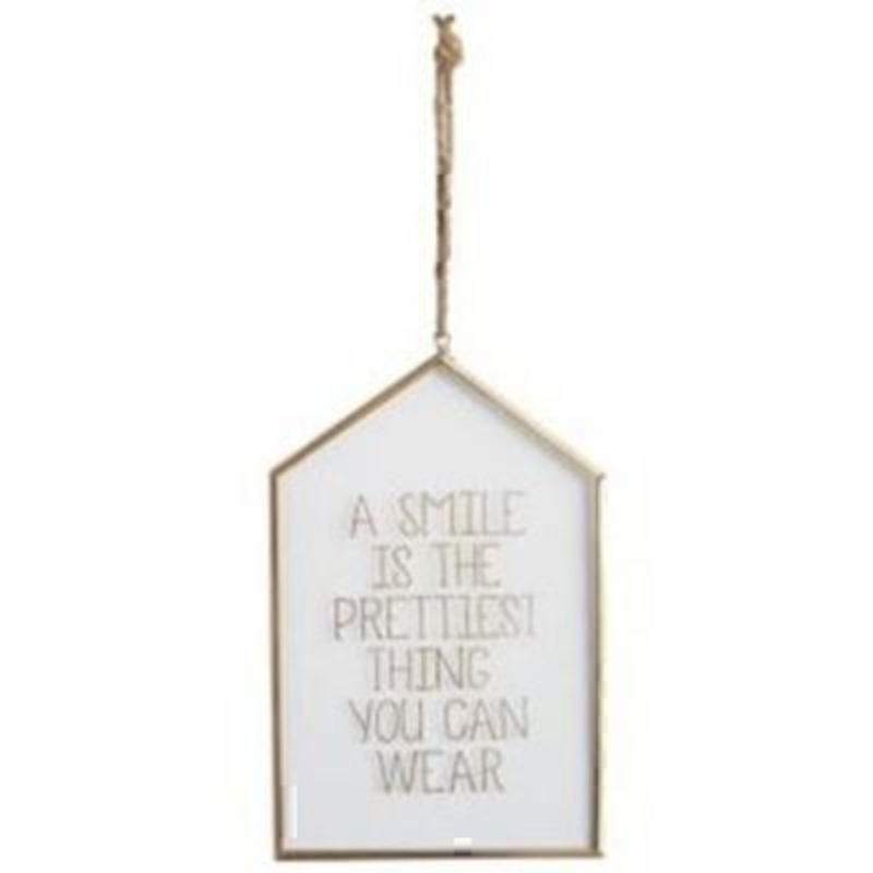 A smile is the prettiest thing you can wear' Glass Hanging Sign by Transomnia. White backed plaque with a gold metal edging and twine for hanging. Features the saying 